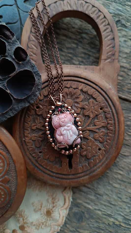 For Cheryl. Rhodonite bear and purple labradorite pendant.