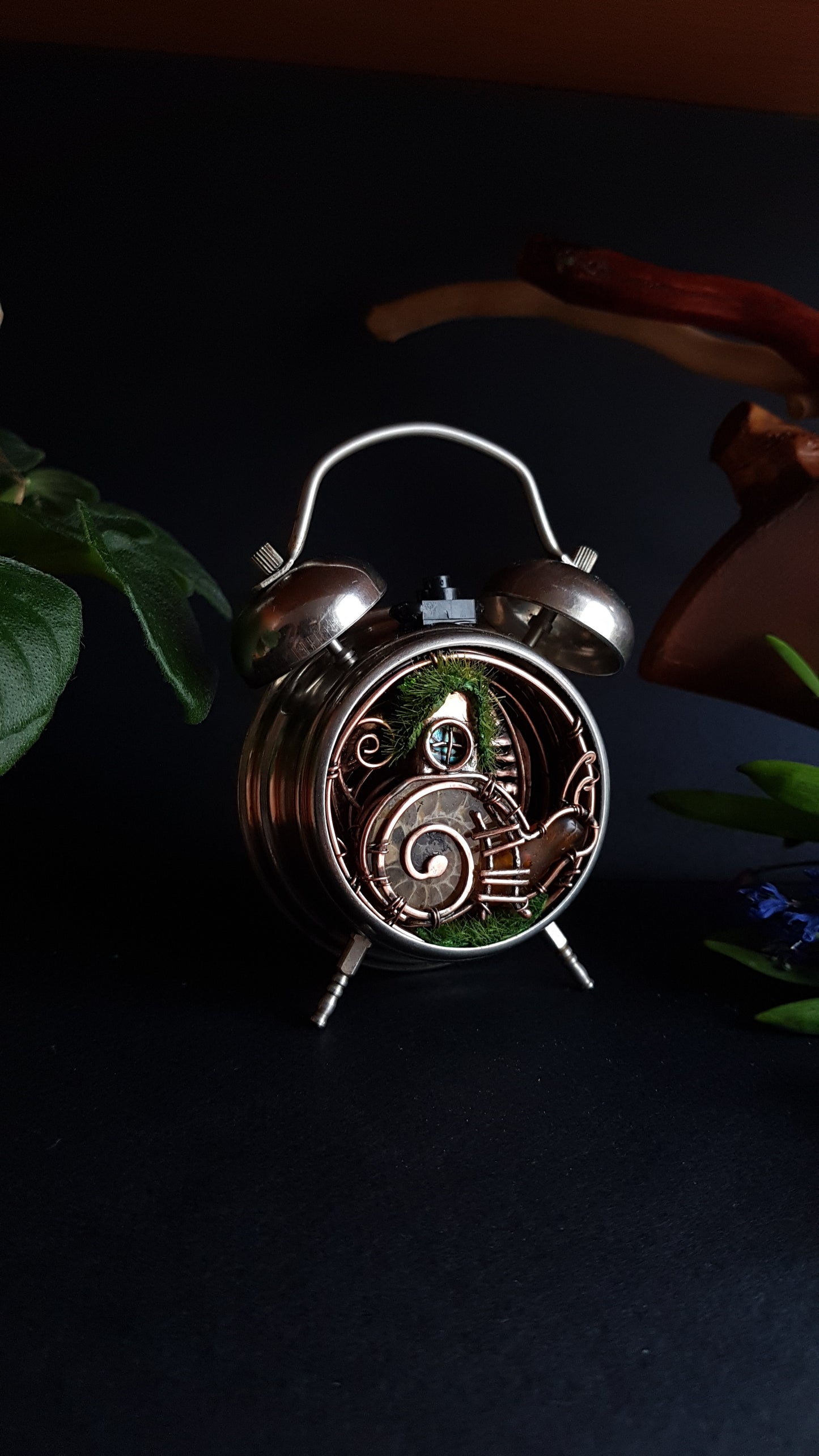 Snail fairy house. Mini world in a clock. Steampunk decor with light.