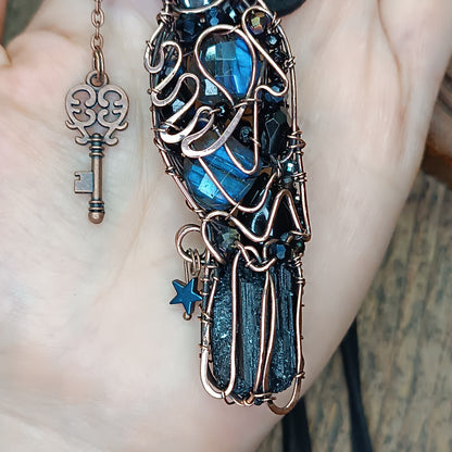 Secret keeper. Raven with the blue star. Wire wrapped necklace