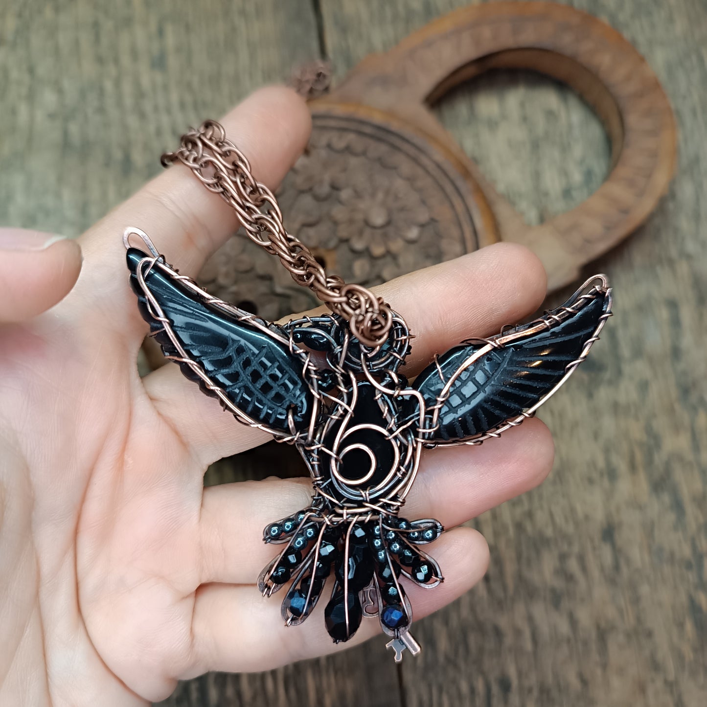 Secret keeper. Raven necklace with open wings.