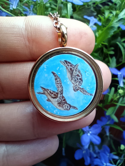 Mini reversible Mermaid and sea turtles pendant.