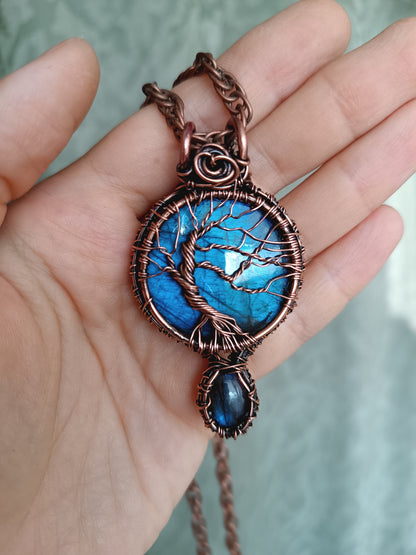 Three tree of life necklaces.