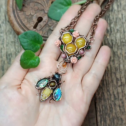 Honey bee pollinating in the rose garden. Necklace.