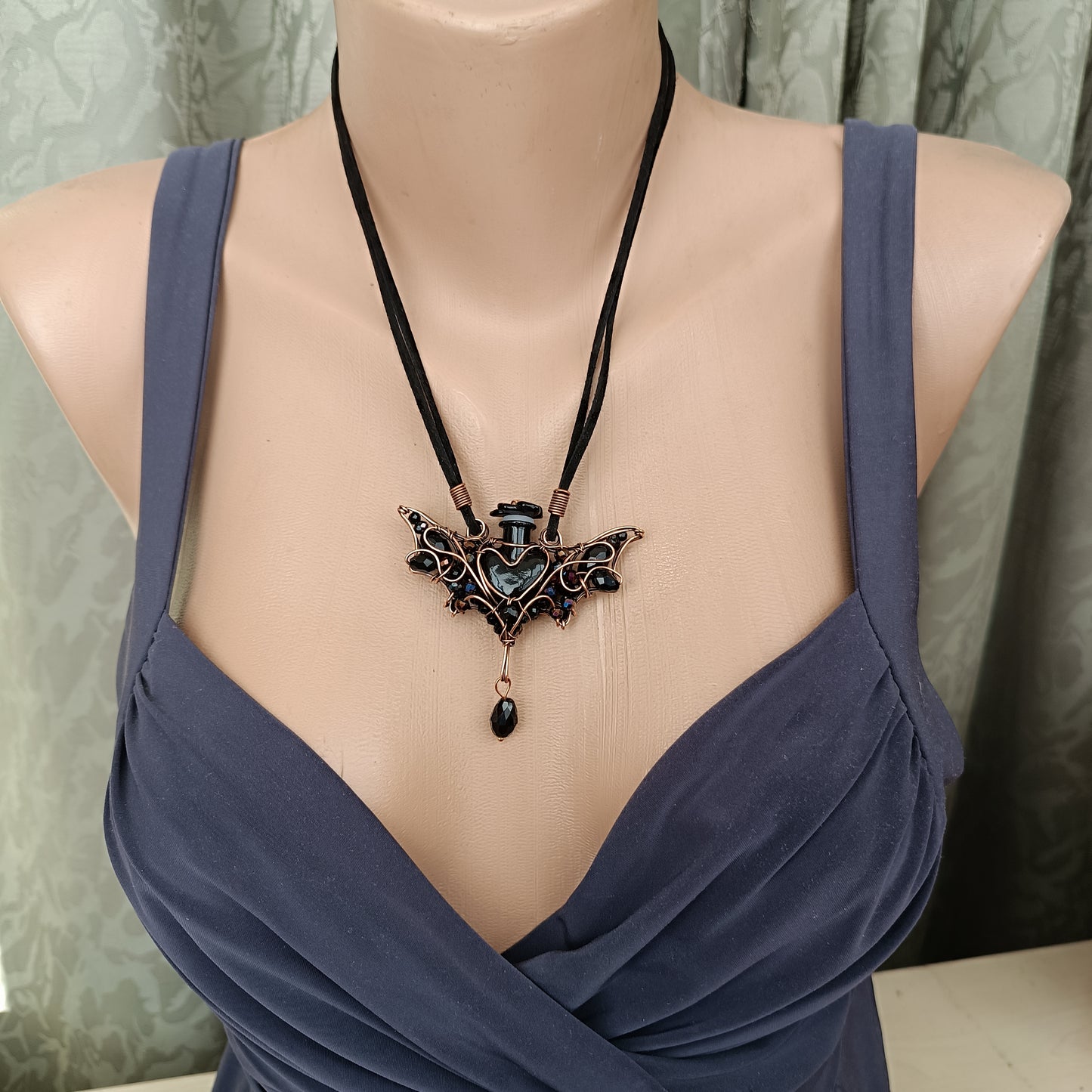 Black (with some purple) bat bottle necklace