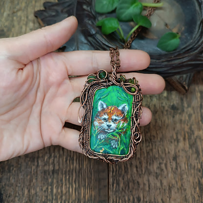 Red panda and a butterfly necklace. Reversible.