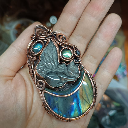 Winged kitty sleeping on the moon