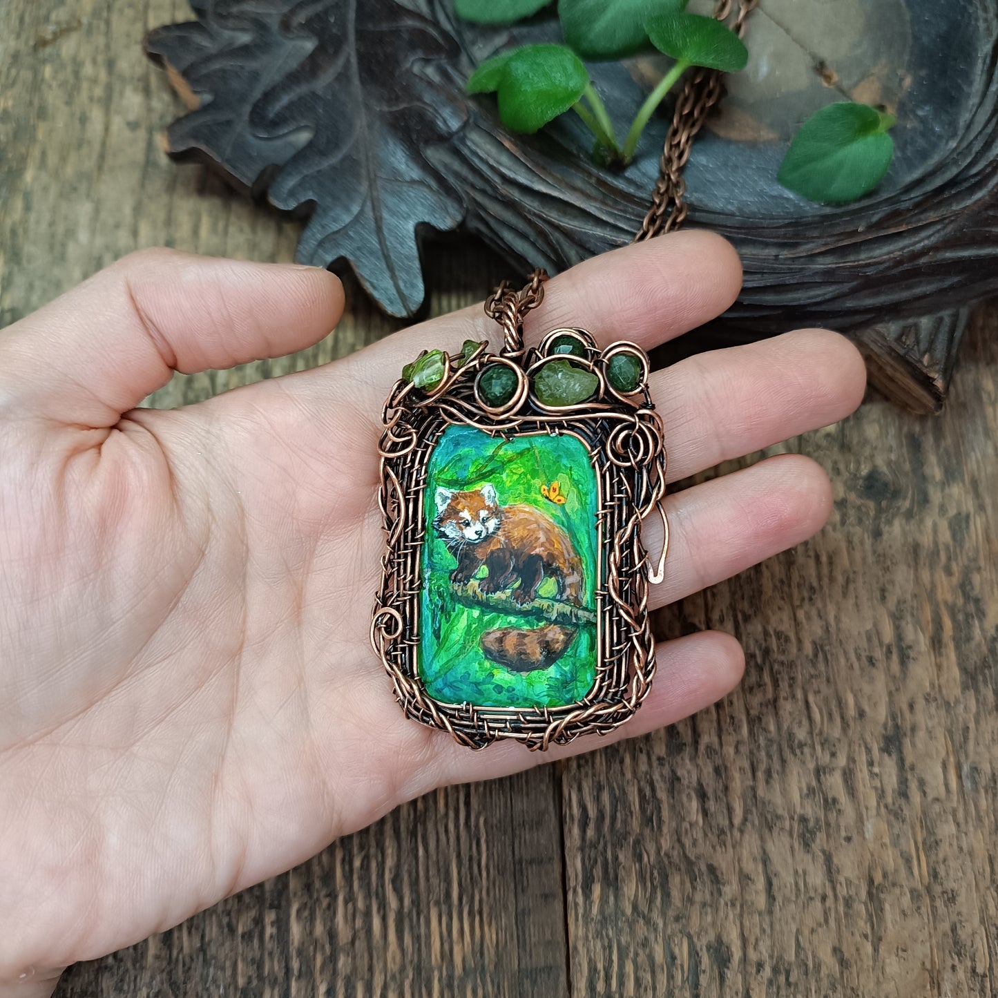 Red panda and a butterfly necklace. Reversible.