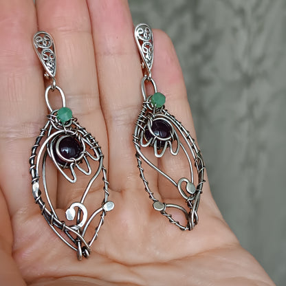 Silver dangling earrings. Amethyst bells.