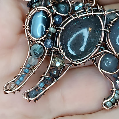 Sweet puppy. Detailed wire wrapped and beaded pendant.