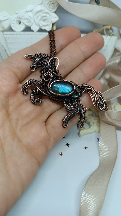 Unicorn and the falling star. Copper pendant with labradorites.