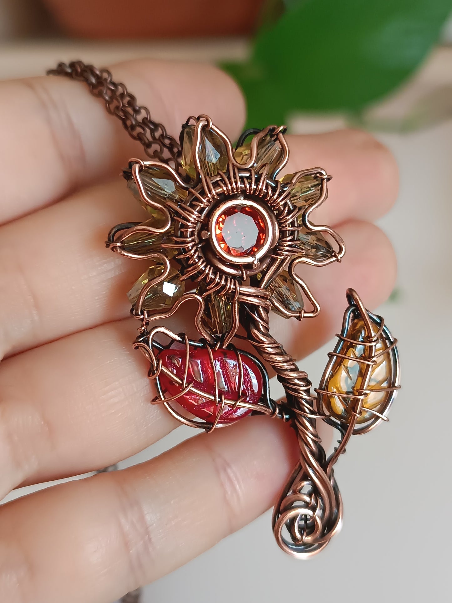 Sunflower pendant with red leaf