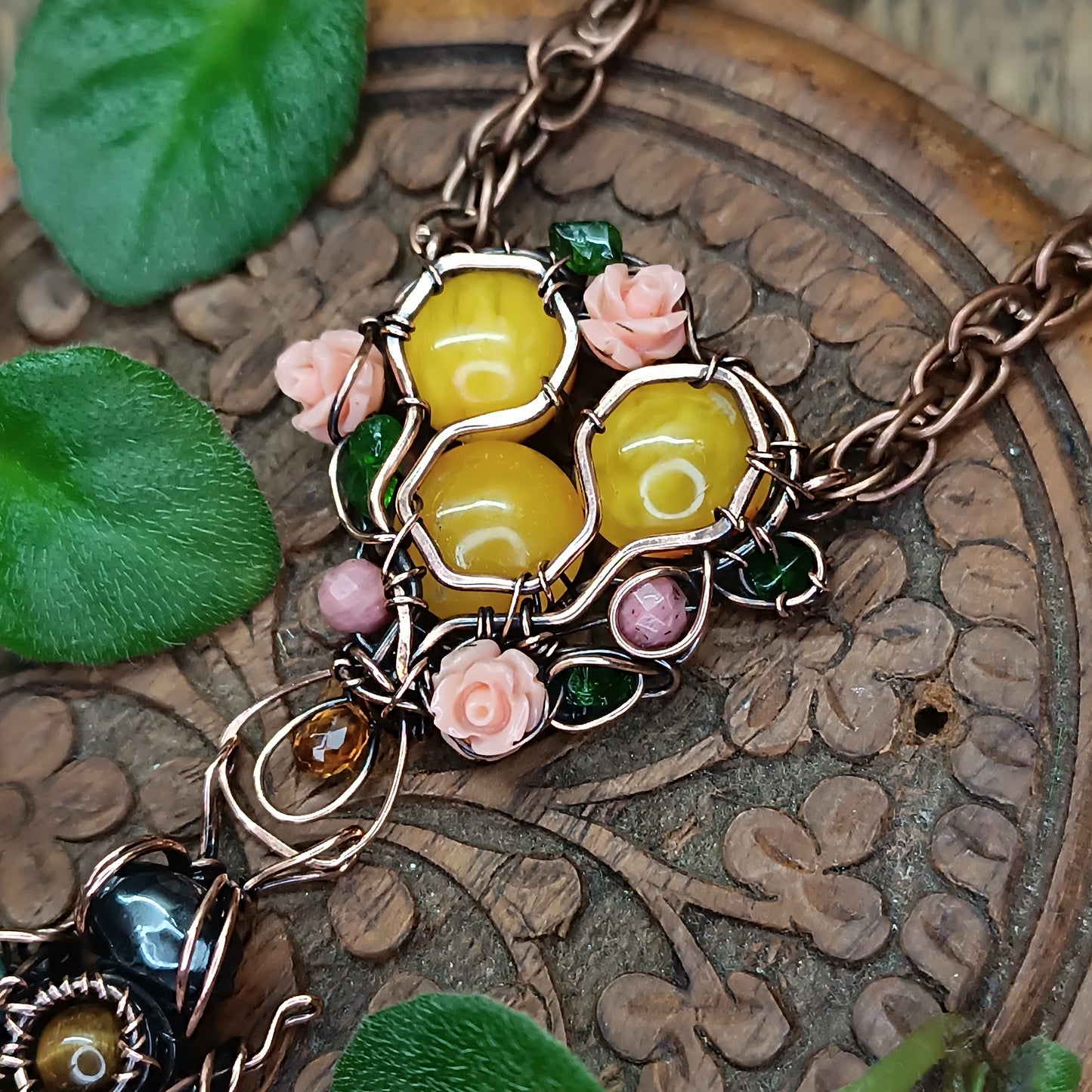 Honey bee pollinating in the rose garden. Necklace.