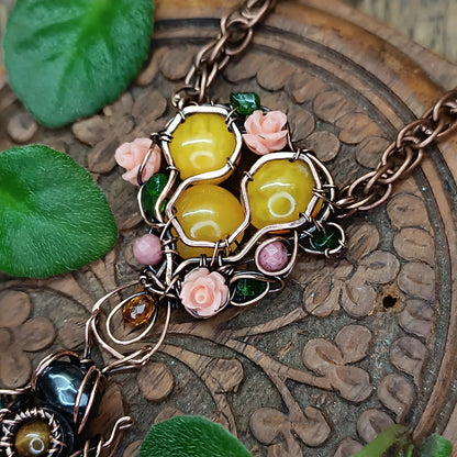 Honey bee pollinating in the rose garden. Necklace.