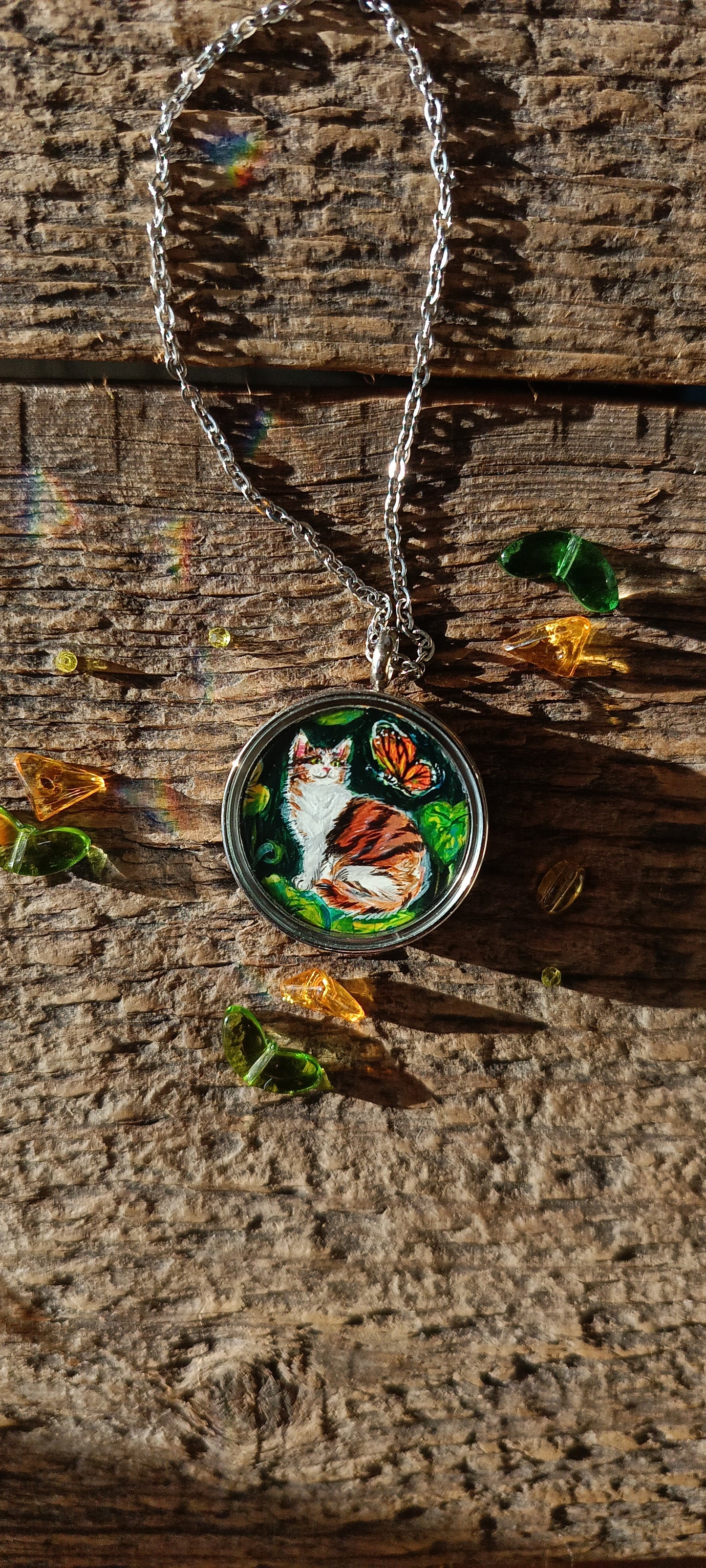 Cat admiring butterflies. Pendant.