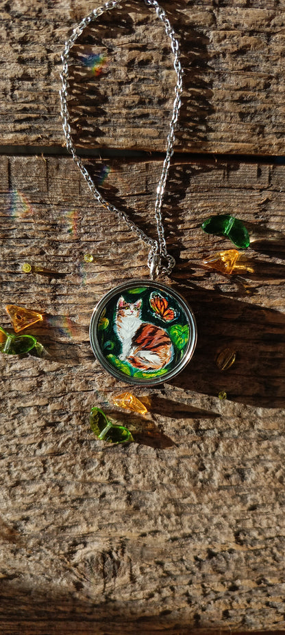 Cat admiring butterflies. Pendant.