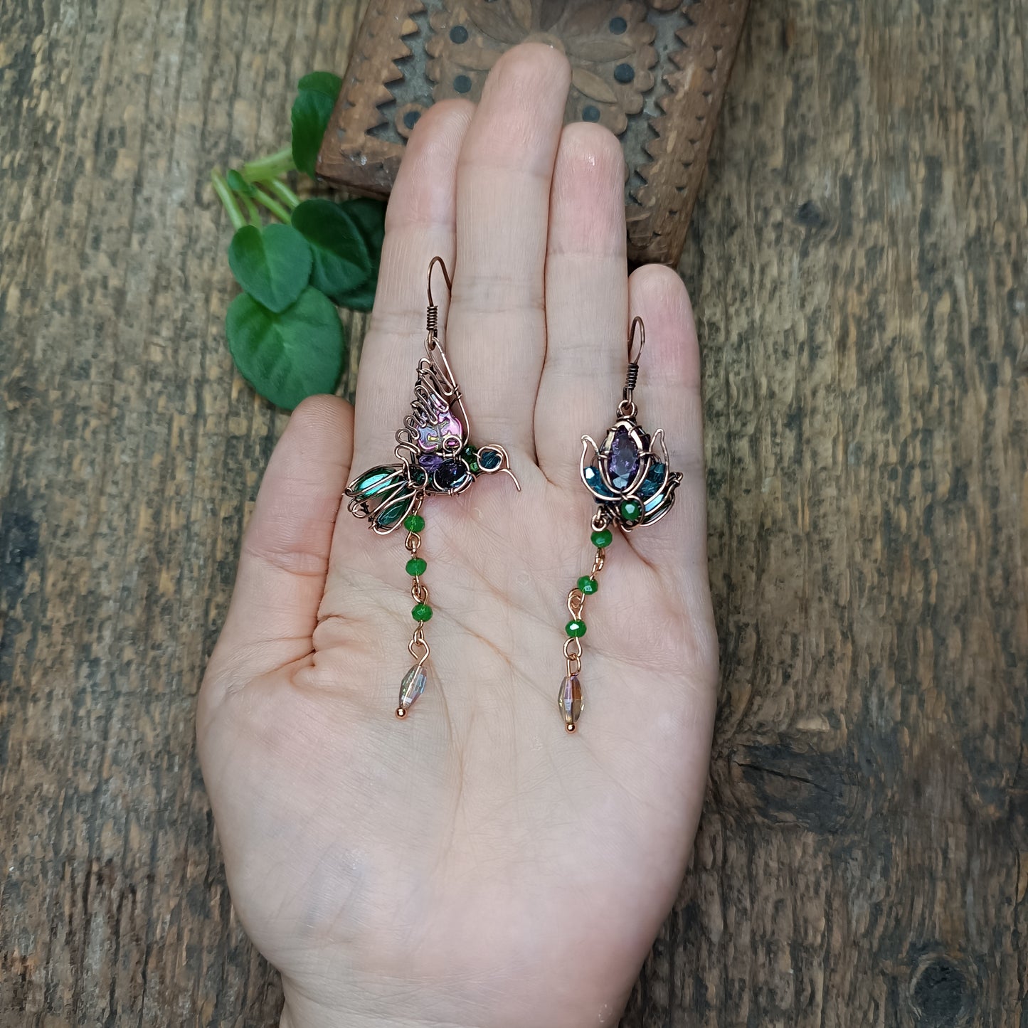 Humming bird and flower dangling earrings.