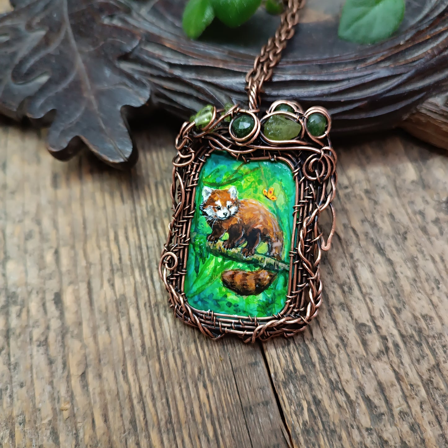 Red panda and a butterfly necklace. Reversible.
