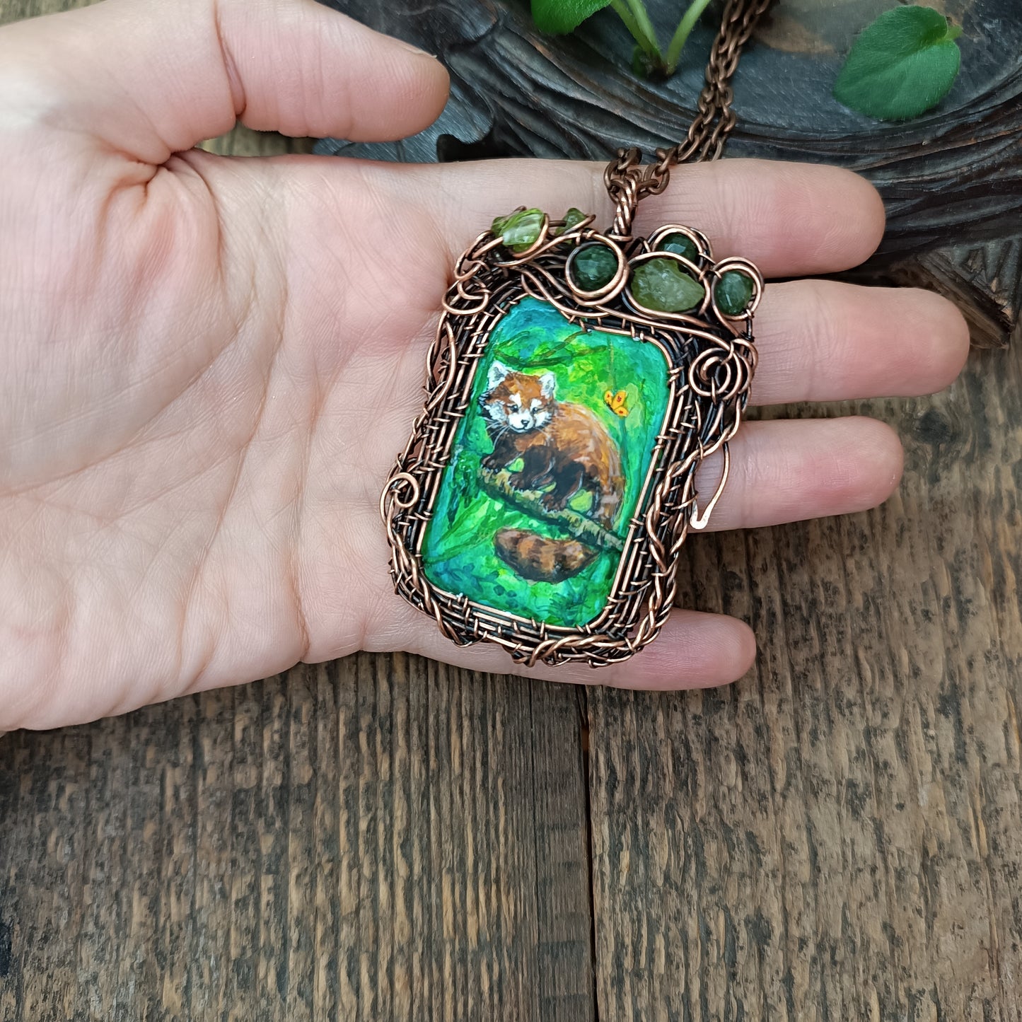 Red panda and a butterfly necklace. Reversible.