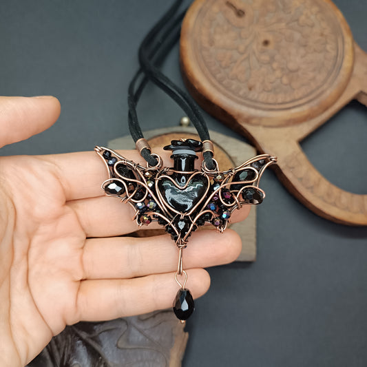 Black (with some purple) bat bottle necklace
