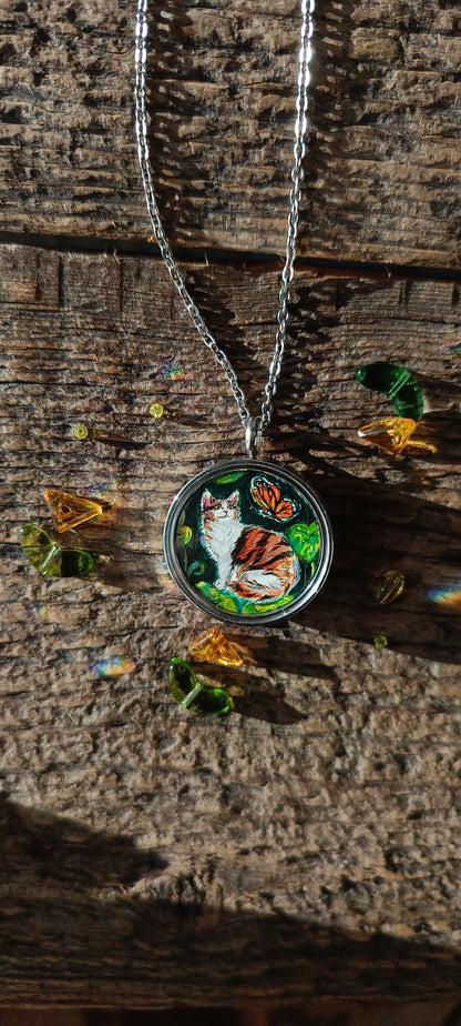 Cat admiring butterflies. Pendant.