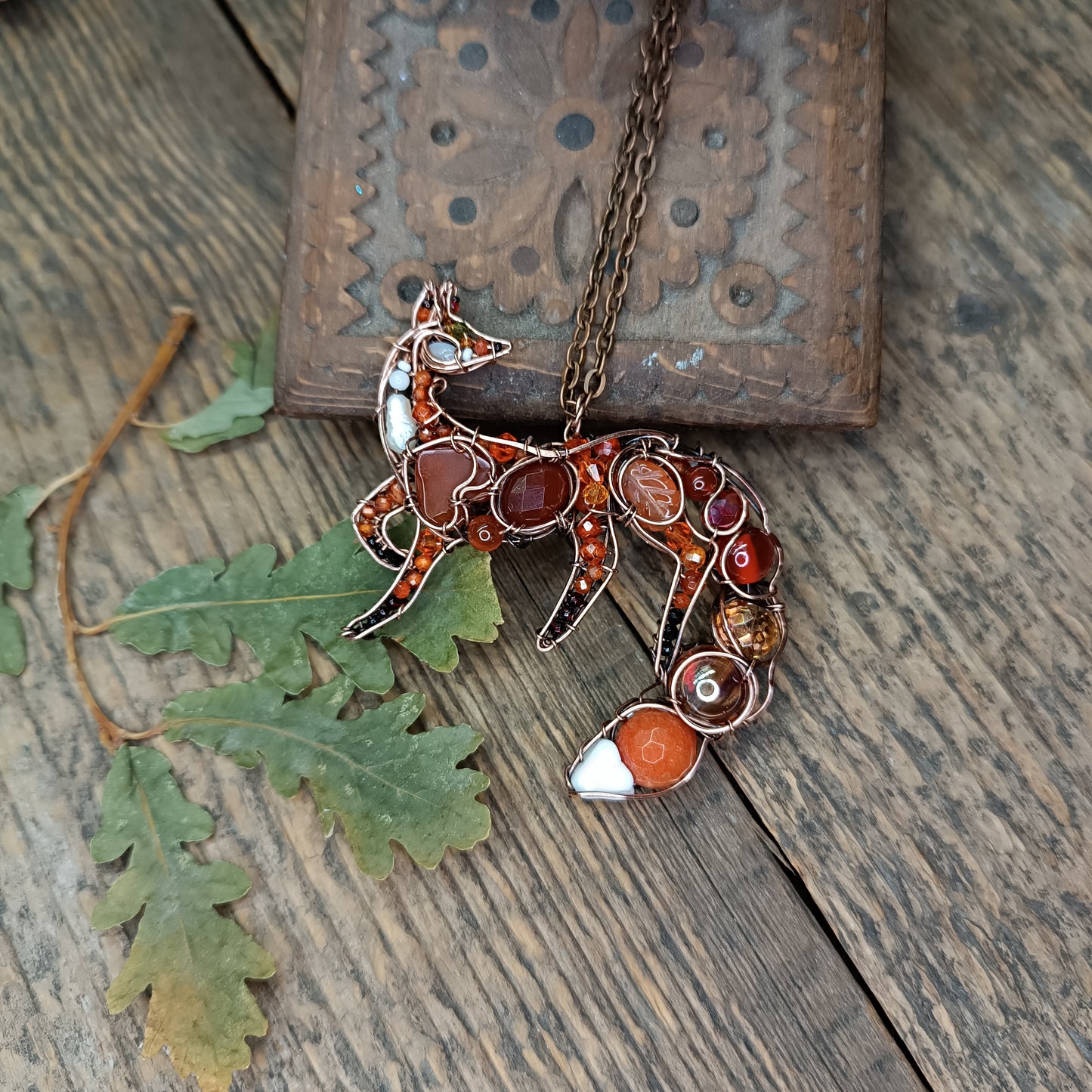 Foxy the swoopy tail! Copper necklace with carnelians.