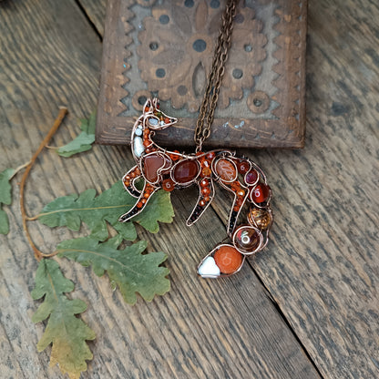 Foxy the swoopy tail! Copper necklace with carnelians.