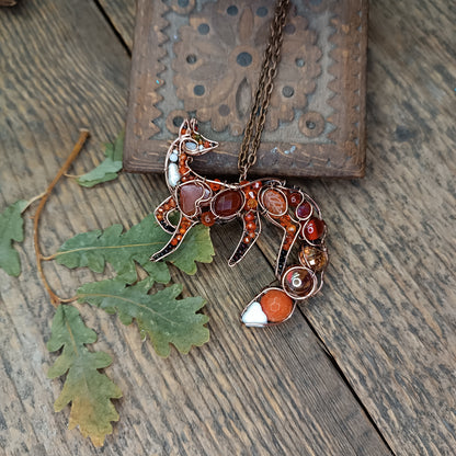 Foxy the swoopy tail! Copper necklace with carnelians.