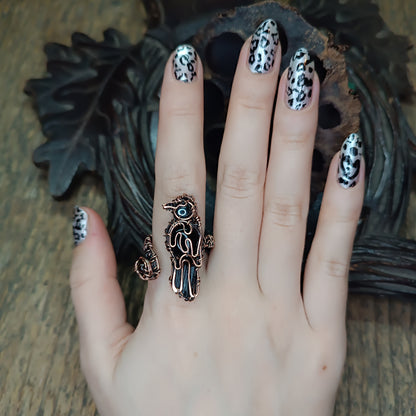 Raven ring.