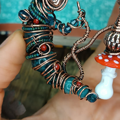 Blue caterpillar necklace