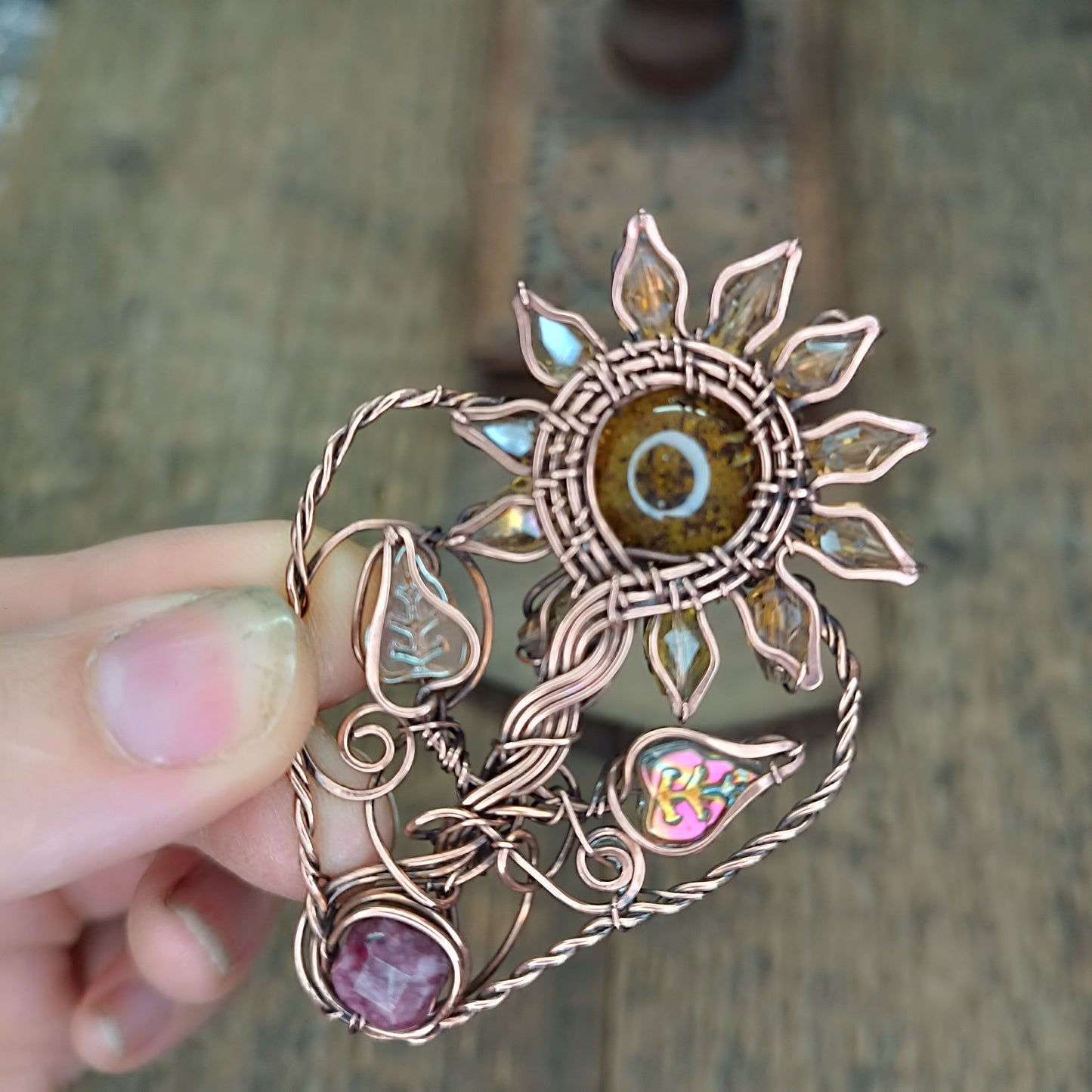 Sunflower pendant with garnet root