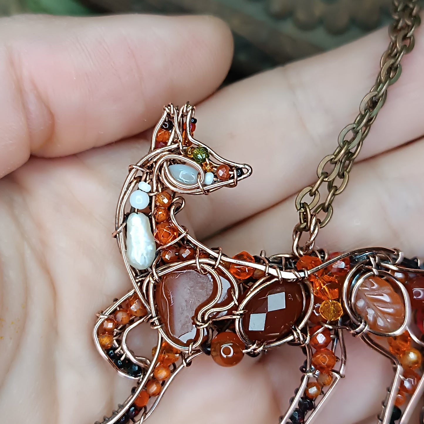 Foxy the swoopy tail! Copper necklace with carnelians.