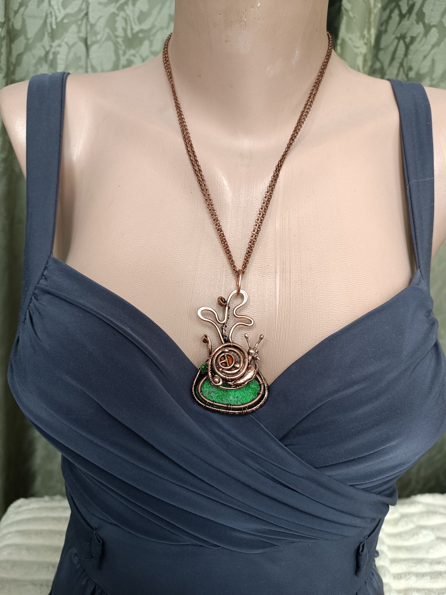 Snail house fairy house necklace with uvarovite.