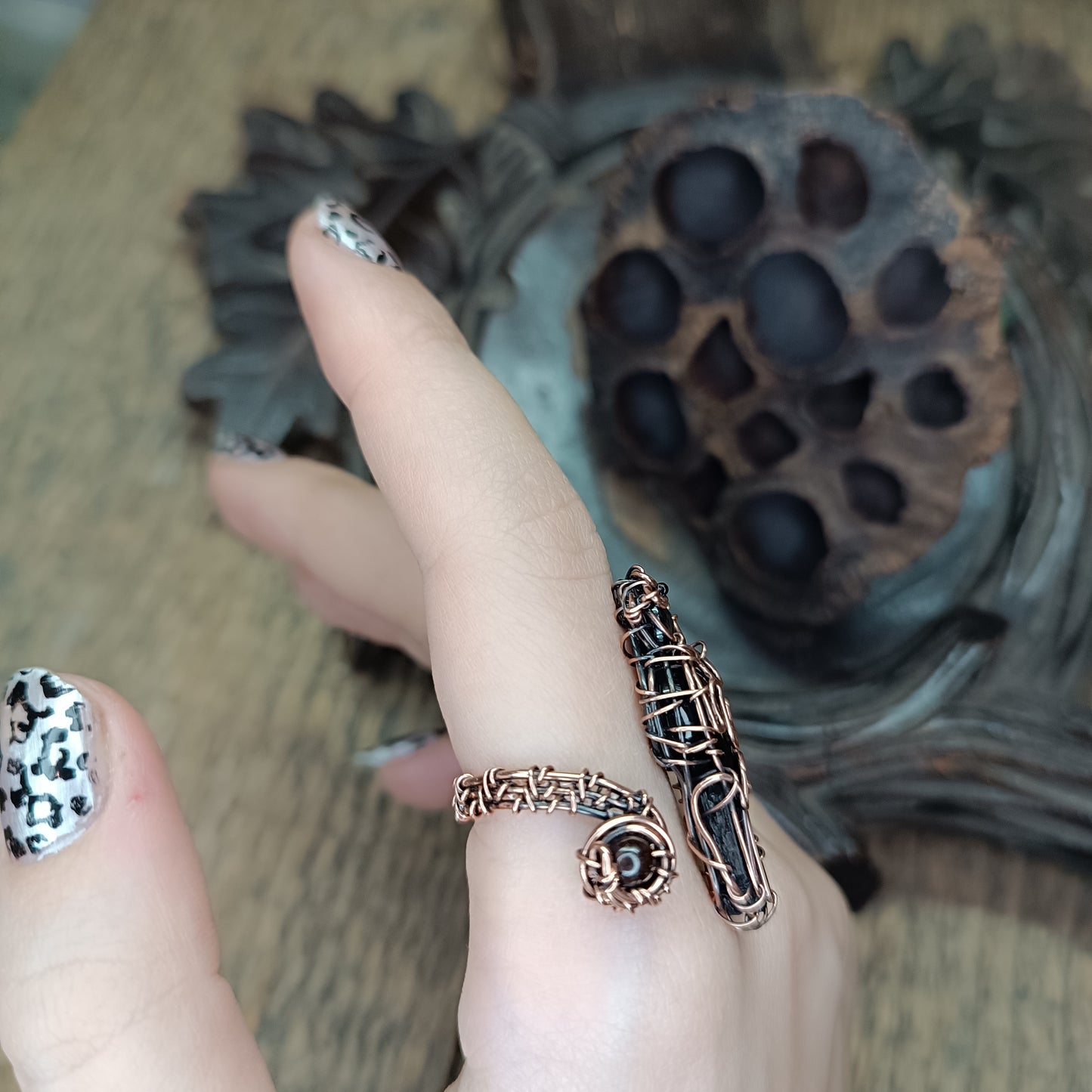 Raven ring.