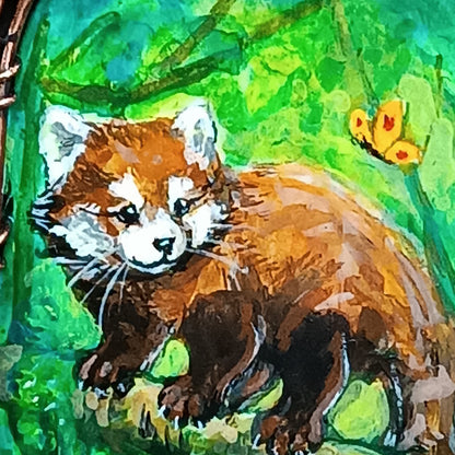 Red panda and a butterfly necklace. Reversible.