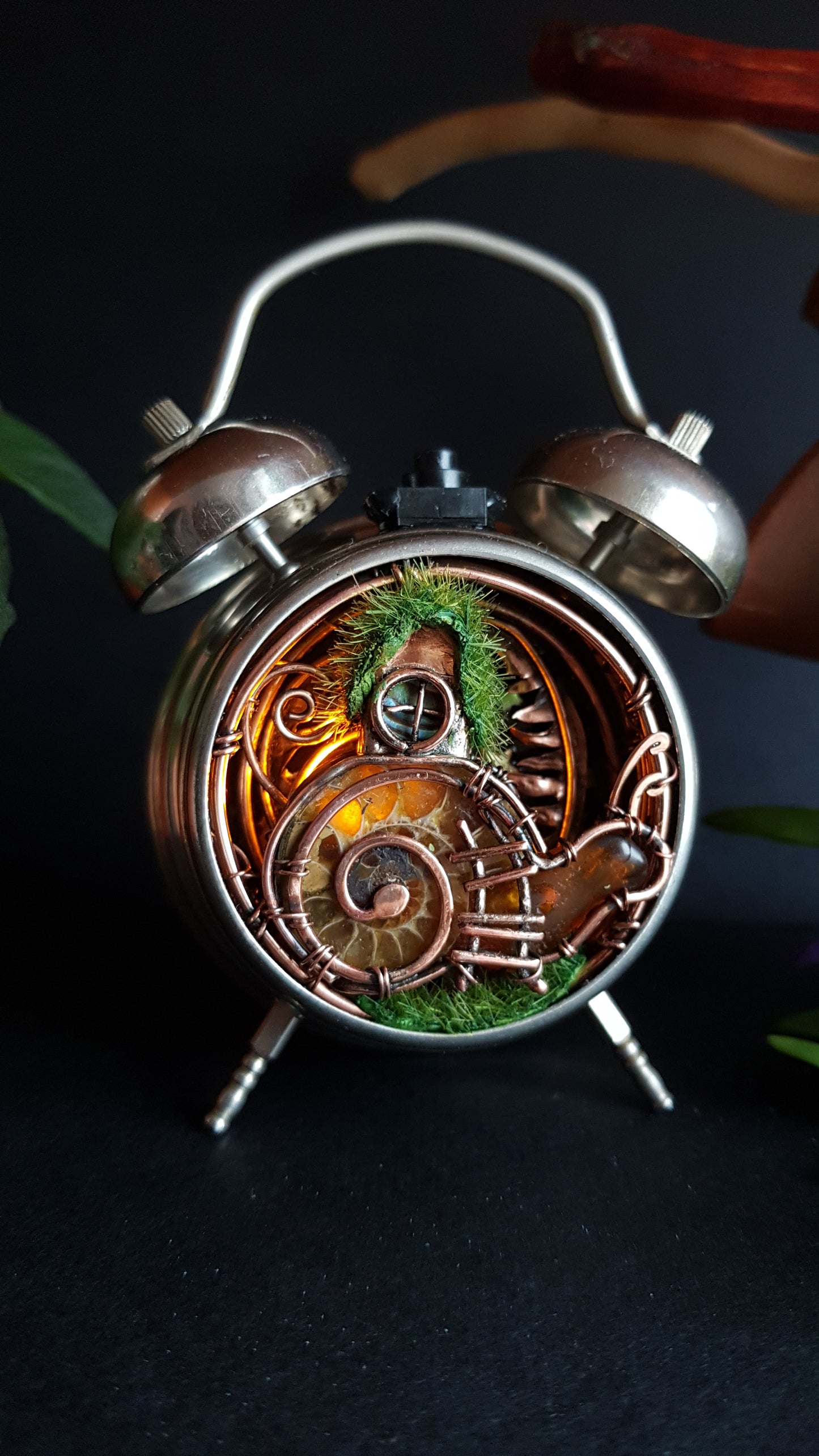 Snail fairy house. Mini world in a clock. Steampunk decor with light.