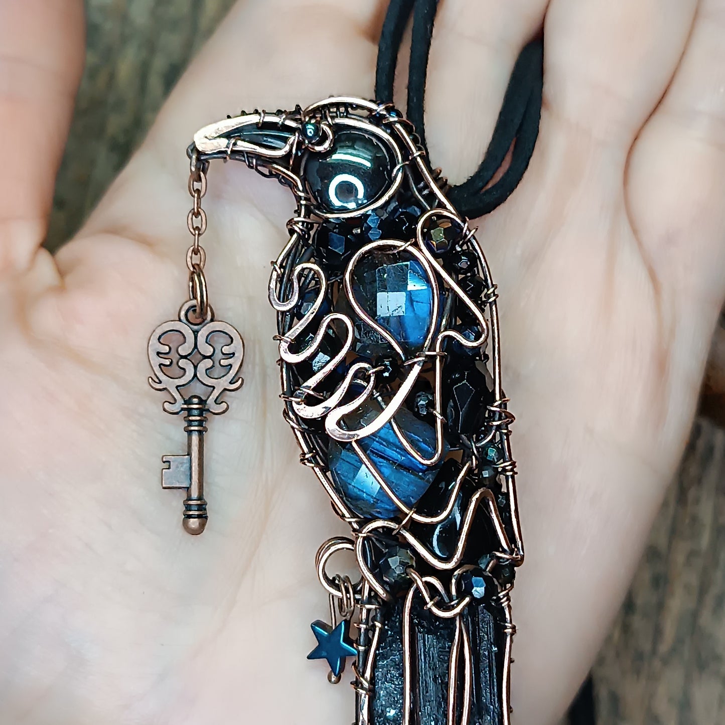 Secret keeper. Raven with the blue star. Wire wrapped necklace