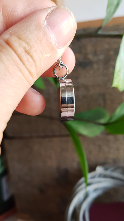 Hummingbird and pink flowers. Double sided mini locket.