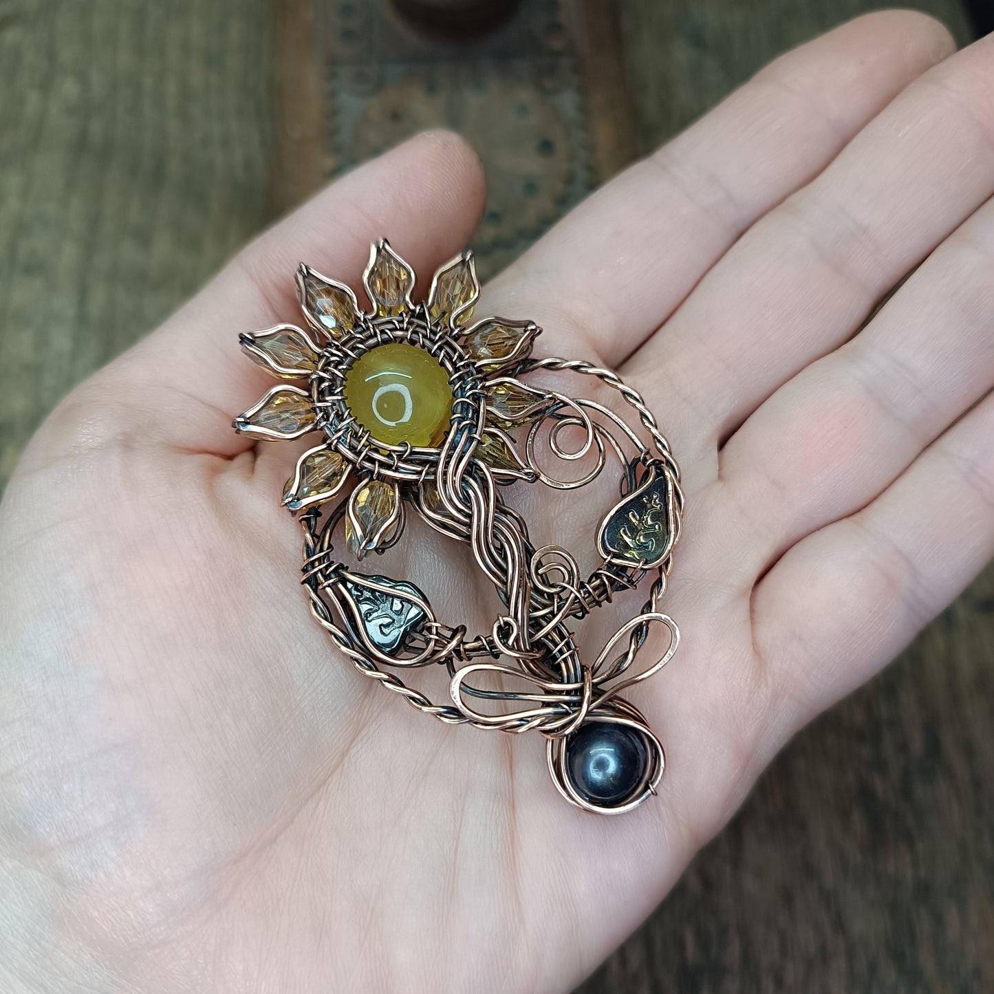 Sunflower pendant with black pearl root