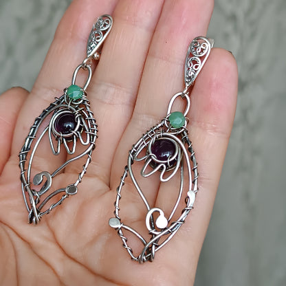 Silver dangling earrings. Amethyst bells.