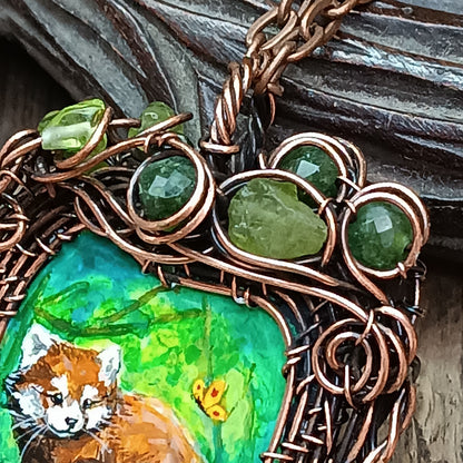Red panda and a butterfly necklace. Reversible.