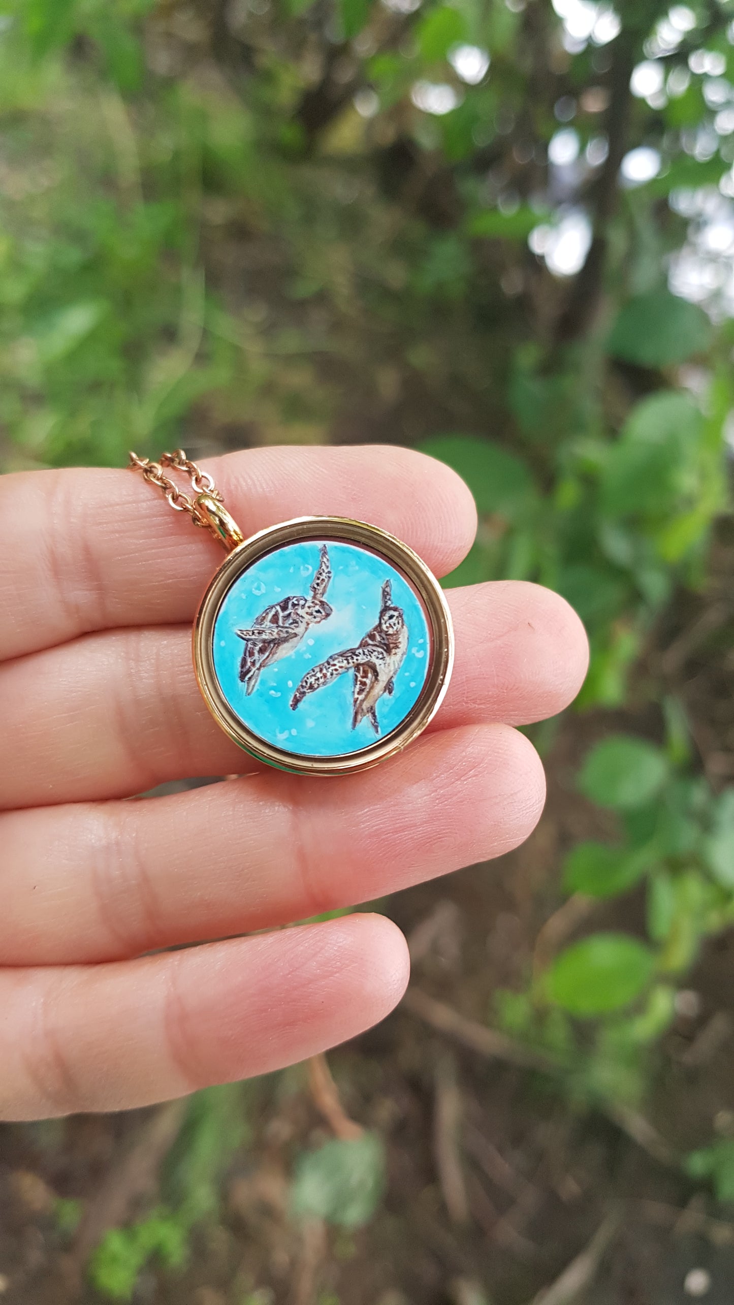 Mini reversible Mermaid and sea turtles pendant.