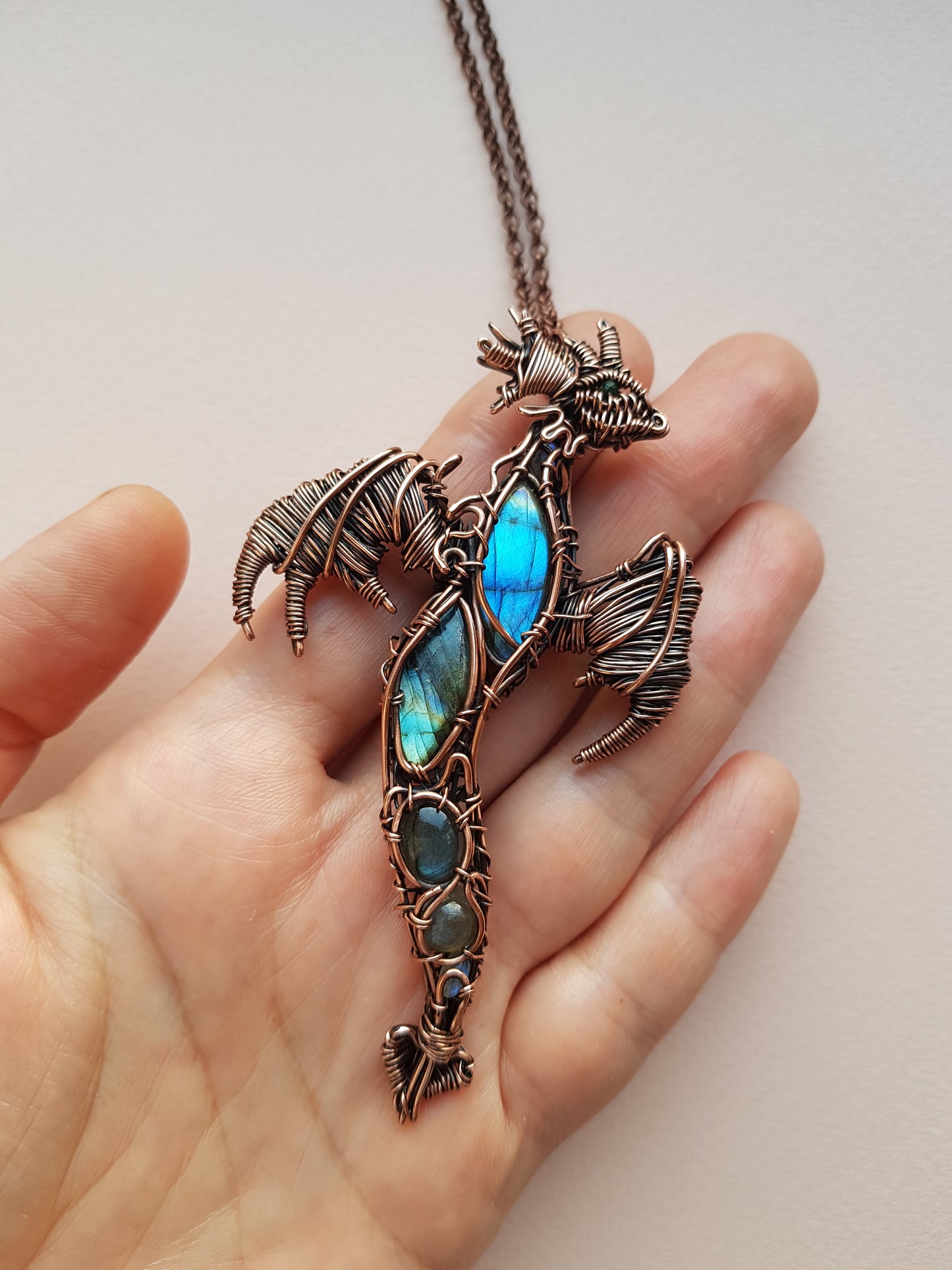 Dancing in the sky. Blue dragon with open wings. Copper pendant.