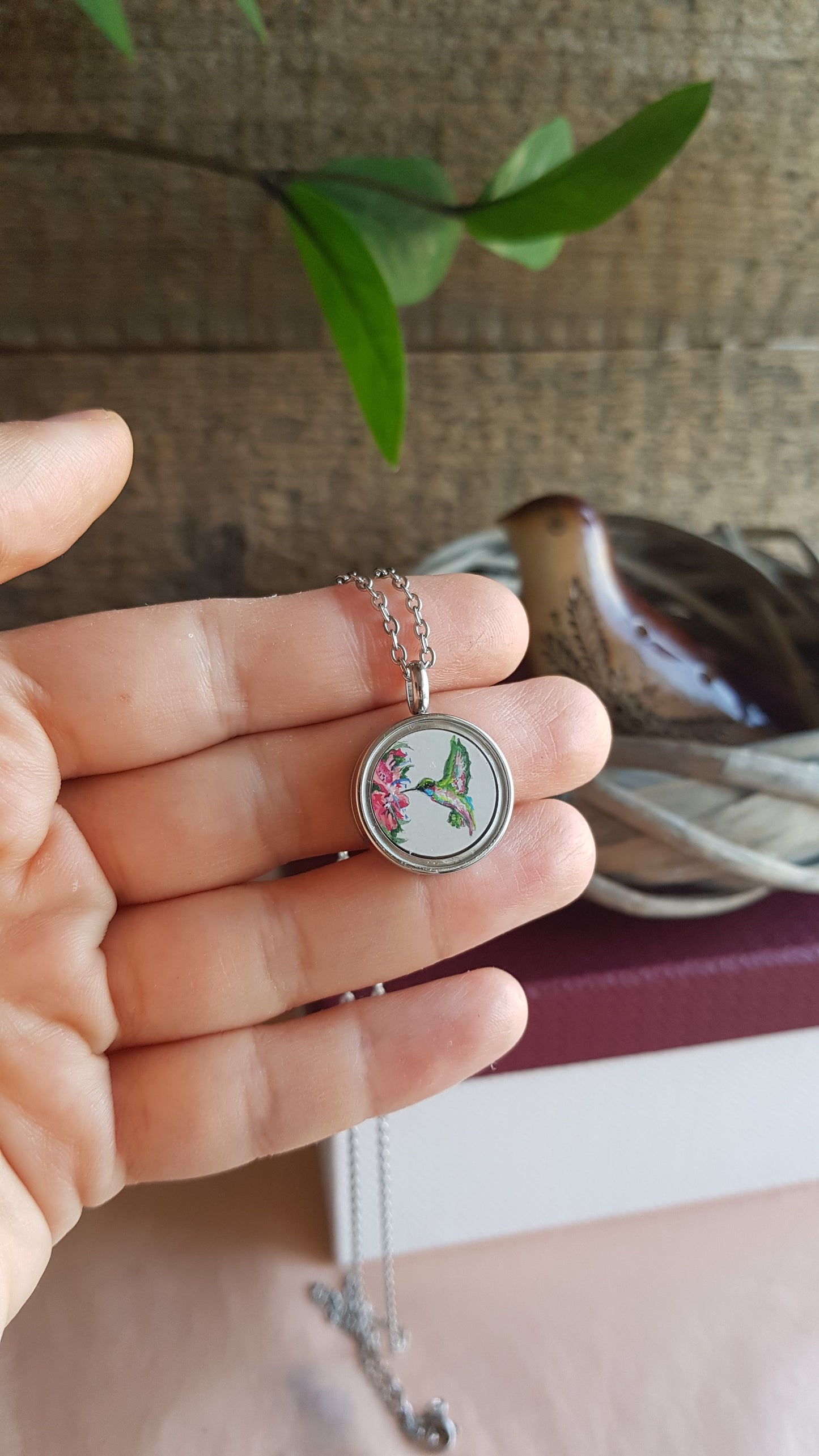 Hummingbird and pink flowers. Double sided mini locket.