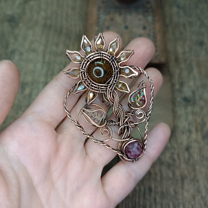 Sunflower pendant with garnet root