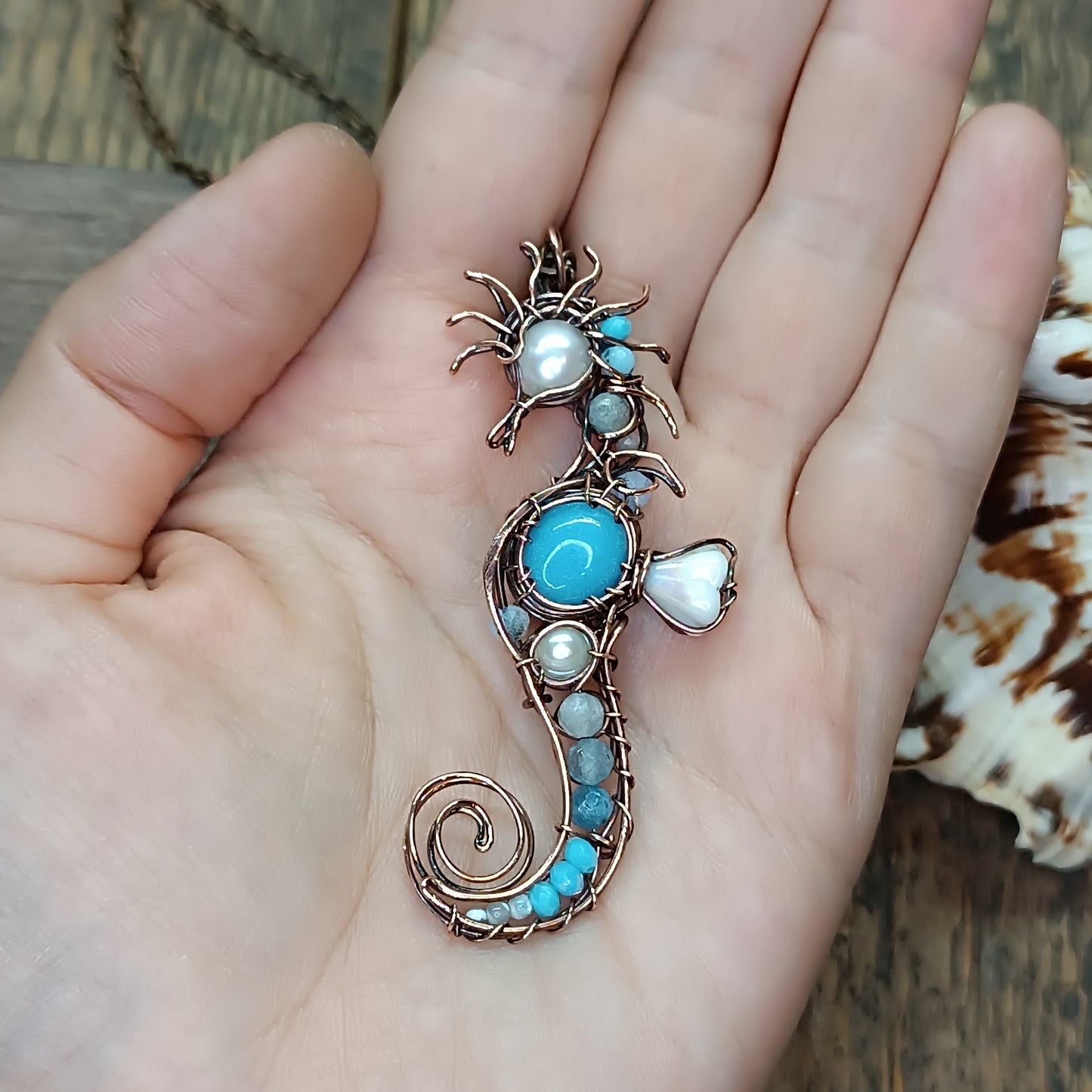 Blue and white seahorse pendant