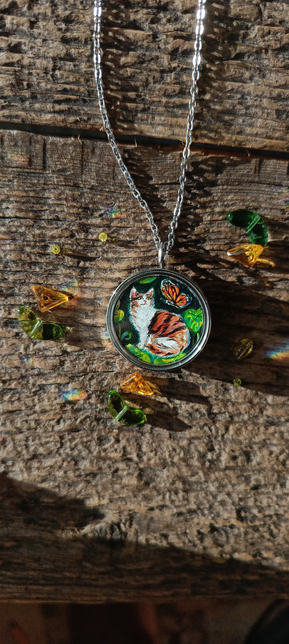 Cat admiring butterflies. Pendant.
