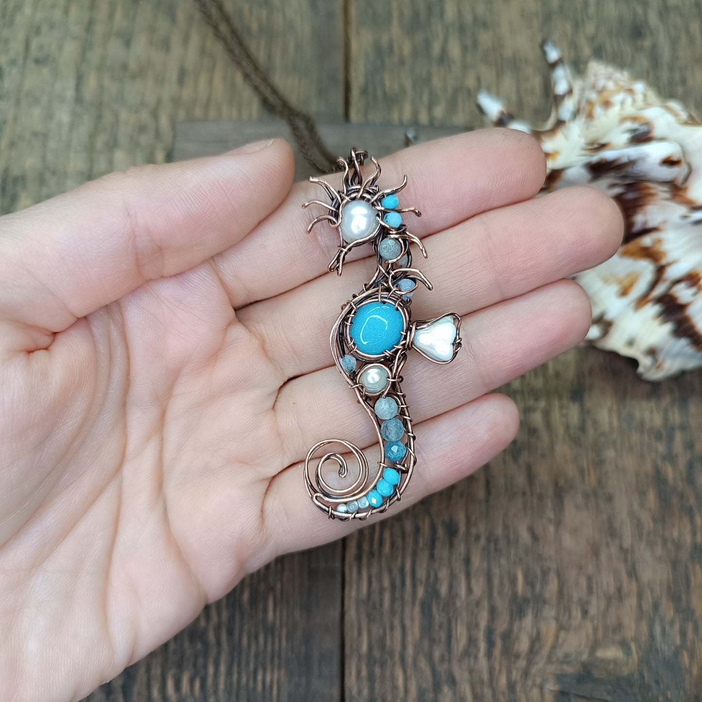 Blue and white seahorse pendant