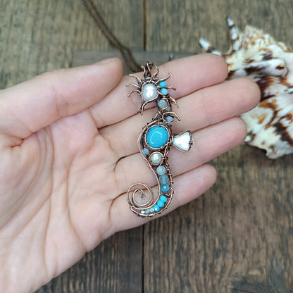 Blue and white seahorse pendant