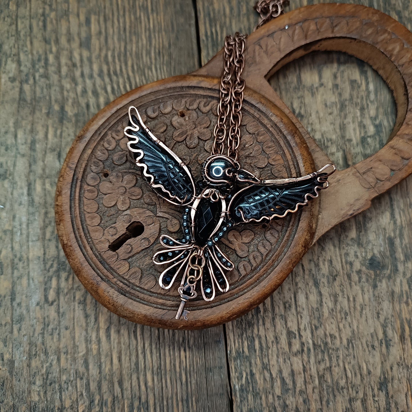 Secret keeper. Raven necklace with open wings.