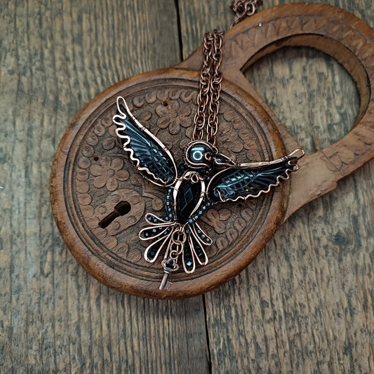 Secret keeper. Raven necklace with open wings.